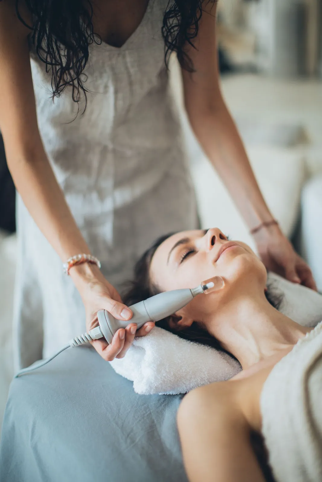 Facial treatment in a calm treatment room